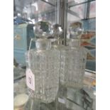 A set of 3 glass spirit decanters and stoppers with 'Hobnail' effect bodies