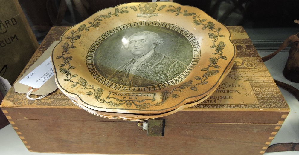 A pair of Wedgewood commemorative plates showing Josiah Wedgewood after Joshua Reynolds,