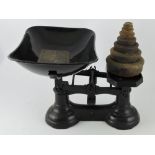A pair of black painted balance scales,