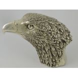 A cast white metal desk weight in the form of an eagle, with a character mark to base, H.