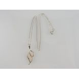 A white metal hardstone mounted leaf form pendant, both pendant and chain stamped 925, 4.5g.