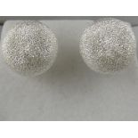 A pair of cubic zironia and white metal ball earrings.