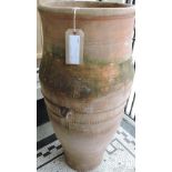 A large Greek style terracotta garden urn of oil jar, H. 96cm.