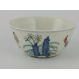 A doucai tea bowl, decorated with figures and chicken, D. 8cm.