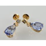 A pair of blue gem ear pendants, possibly tanzanite, set in yellow metal, 2.5g.