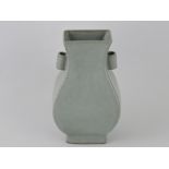 A celdon glazed rectangular baluster shaped vase, with twin handles, H. 15cm.