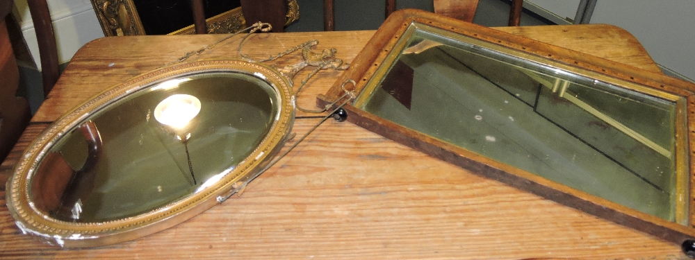 An early 19th century plaster framed oval wall mirror in the Adams style,