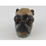 A cold-painted bronze inkwell in the form of a pug's head, H. 9cm.