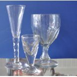 An early 19th Century cordial glass with faceted glass stem,