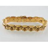 An 18ct yellow gold articulated bracelet by Fomp, of lozenge boss form, L 19 cms, stamped 750,