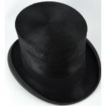 A gentleman's black silk top hat by Dunn & Co.