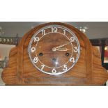 An Art Deco figured walnut mantle clock