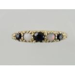 A sapphire and opal dress ring, set in a 9ct gold band, 1.5g.