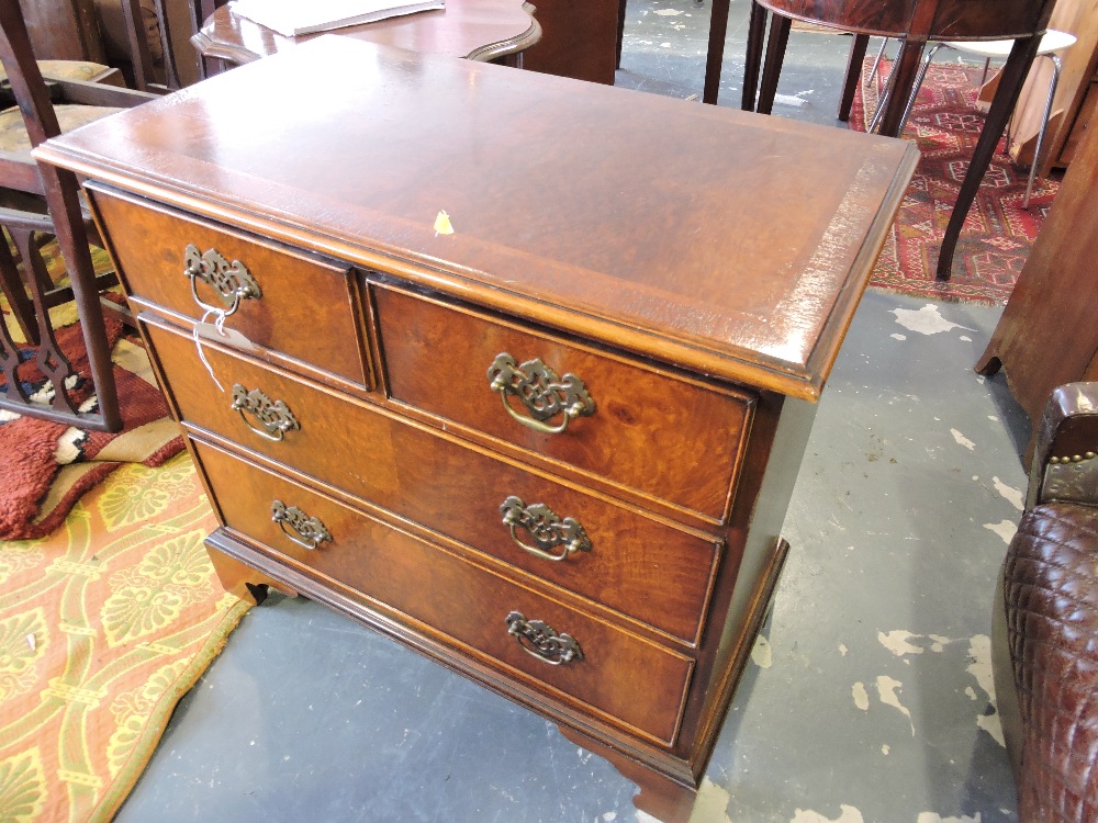 A small Georgian design crossbanded burr walnut chest fitted 2 short and 2 long drawers on bracket