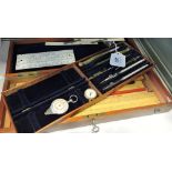 An early  20th century mahogany cased containing drawing instrument set