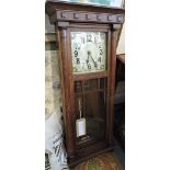An early 20th Century Continental oak cased Vienna style wall clock,