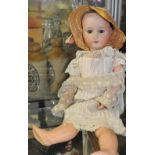 An early 20th Century Heubach Koppelsdorf bisque head doll with sleeping eyes,