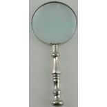 A large table magnifier, with a turned chromium handle, L. 23cm.