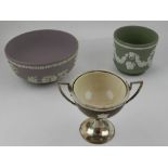 A cream Minton bowl set within a wooden and white metal cup,