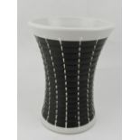 A Denby stoneware vase, glazed in black and white ribbed decoration, bears factory mark to base. H.