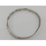 An 18 carat white gold chain link bracelet.