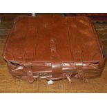 Three brown leatherette suitcases