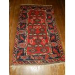A red ground Turkmen runner, having geometric pattern to centre, multi-bordered and fringed. L.