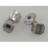 A pair of platinum, diamond, and sapphire set cufflinks, boxed.