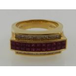 An unusual 18 carat yellow gold, diamond, and ruby ring, in the Modernist taste.