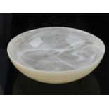 A cream glass bowl, having white internal glazed brush strokes. D.23.