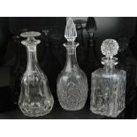 Three cut and moulded glass decanters.