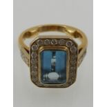 An 18 carat yellow gold, aquamarine and diamond set ring, the aquamarine of approx. 2.