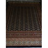 An Afghan style Bokhara rug, having multi elephant pad medallions to centre,