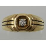 A yellow metal and single diamond set gents ring, the stone of approx. 0.