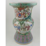 A Chinese hard paste porcelain canton vase, decorated in the famille verte and rose palette having