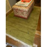 A modern green ground carpet. H.243cm W.168cm