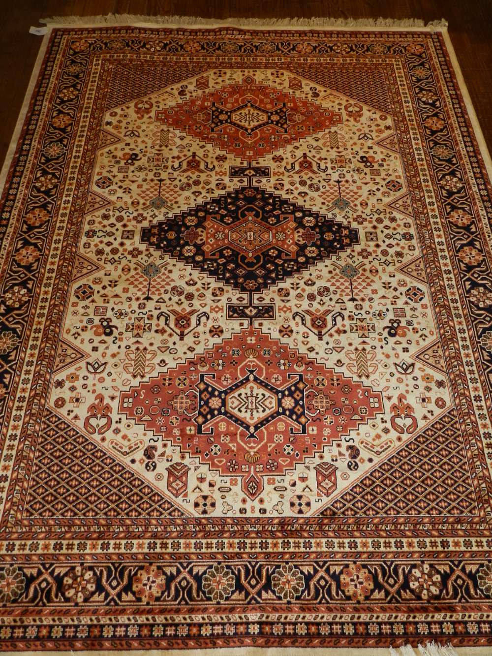 A cream ground Caucasian style carpet,
