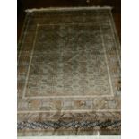 An olive ground Afghan style Bokhara rug, having elephant pad medallions to centre,
