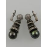 A pair of platinum, white and black diamond, and Sou Sea pearl articulated drop earrings.