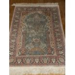 A Persian prayer rug. L.123cm W.