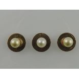 Three pearl set collar studs, two in yellow metal stamped 9ct, 3g.