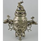 A Chinese white metal censer, of baluster form and decorated with birds and dragons on a bat base,