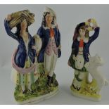 A late 19th century Staffordshire flat-back figure group, modelled as a lady and gentleman,