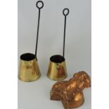 A pair of brass cider measures, of tapering form with iron handles,