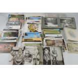 A quantity of postcards including images of Tattoos, (qty).