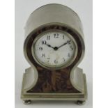 An Art Deco style mantle clock, the balloon-shaped case with tortoiseshell effect front,