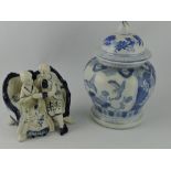 A blue and white ginger jar, together with a model of a courting couple.