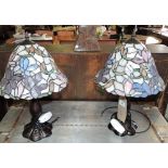 A pair of Tiffany style table lamps with coloured leaded shades, H.