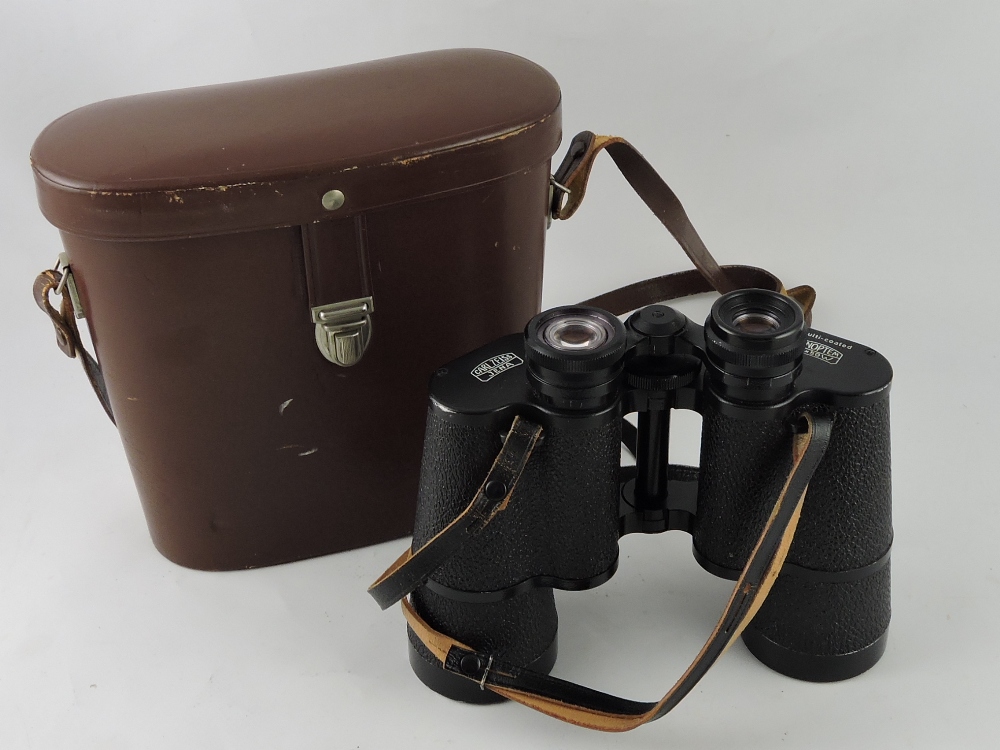 A pair of Carl Zeiss field glasses, in fitted brown leather case.