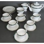 A Royal Worcester tea service, six place settings including cups, saucers, plates,